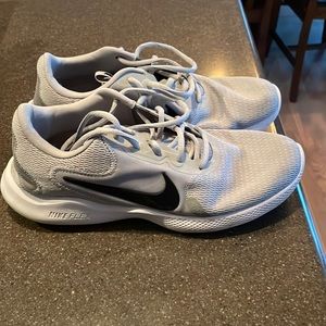 Nike Flex running shoe.  Size 9.5. Light gray with Black swoosh.